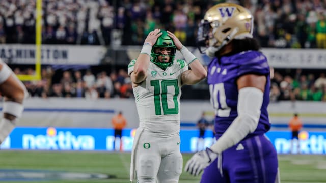 Oregon Ducks quarterback Bo Nix reacts to a play against the Washington Huskies in the Pac-12 Championship.